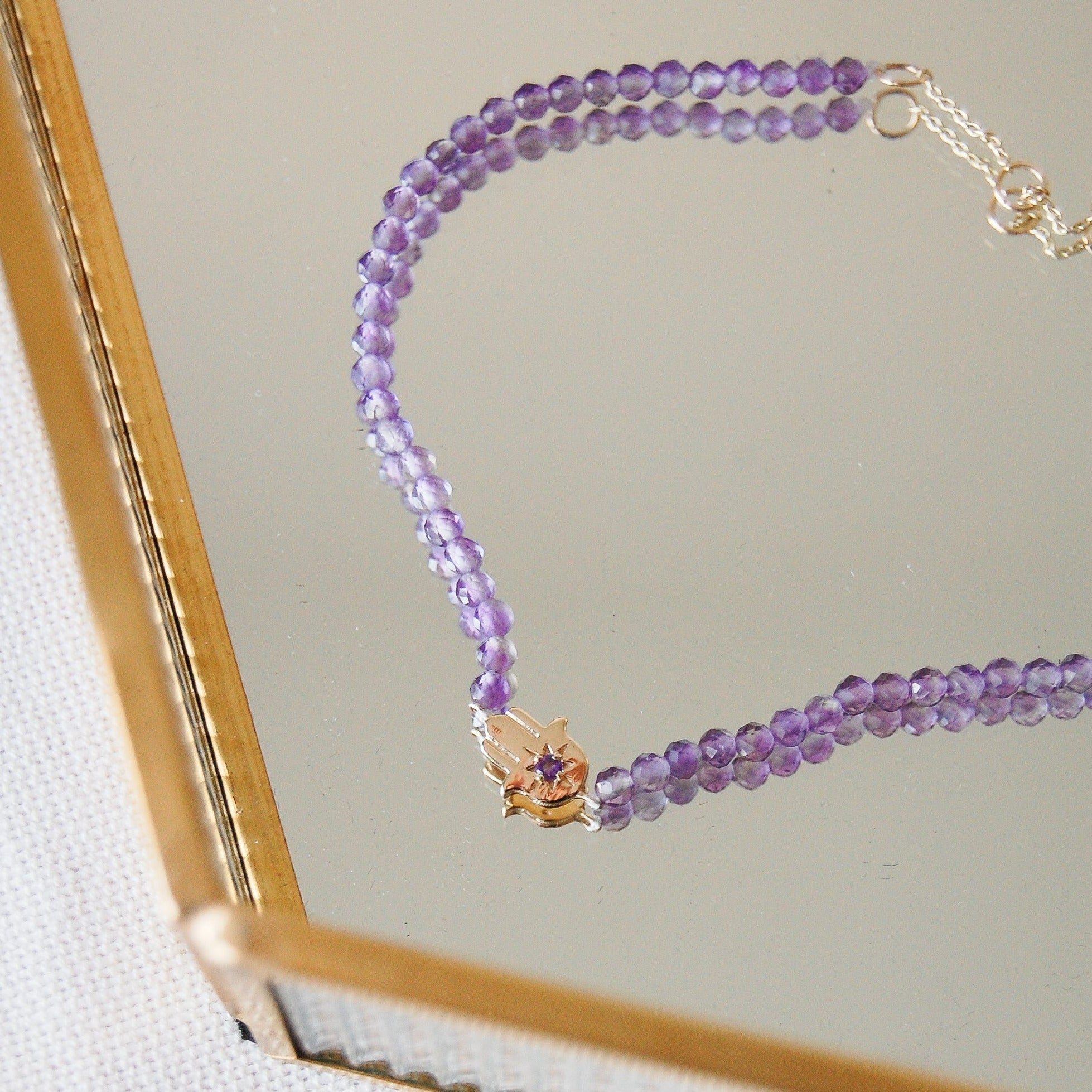 hand of fatima amethyst beaded bracelet 9k gold in mirror jewellery box