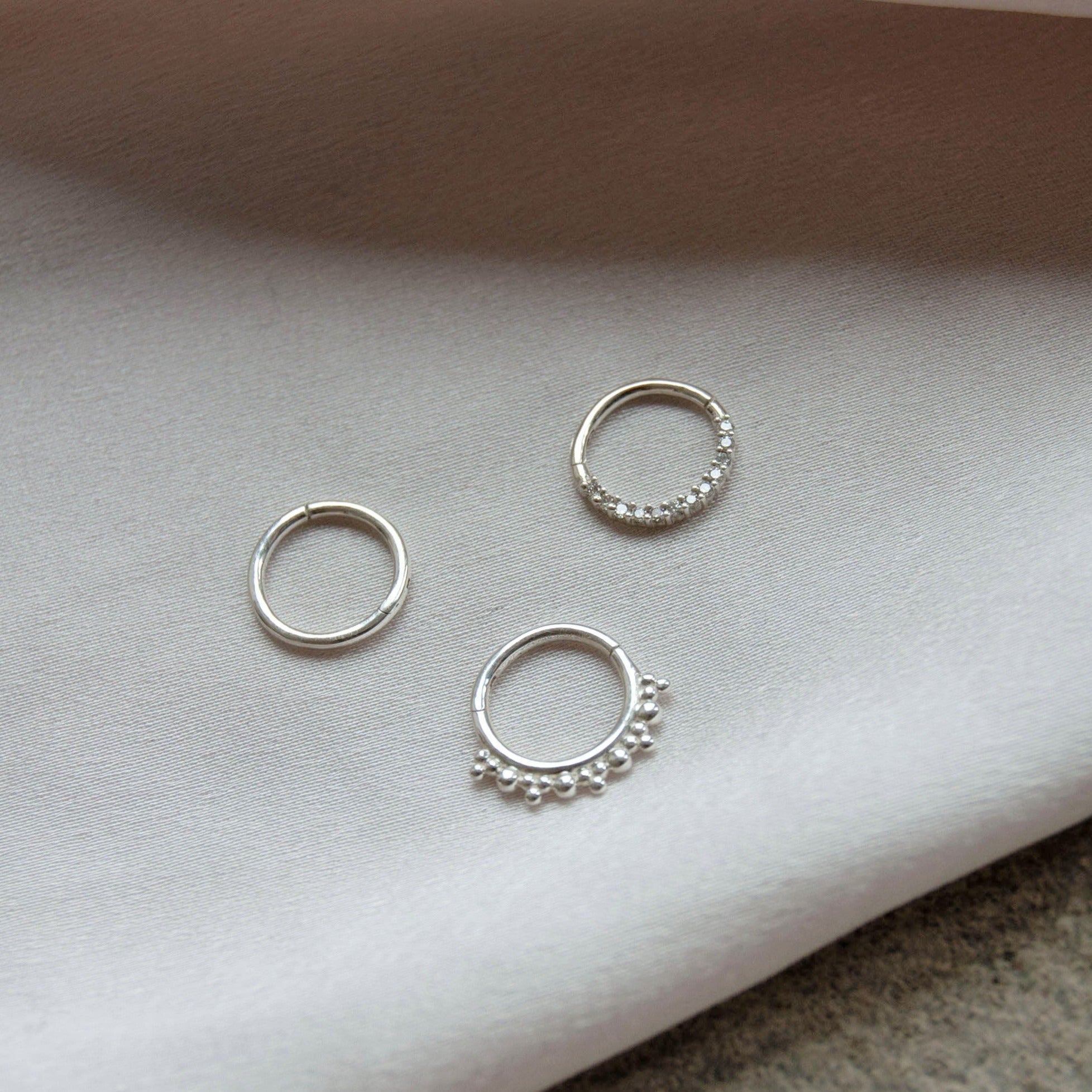 trio of daith earrings in sterling silver