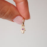 model hand holding Hand of Fatima Amethyst Earring hoop 9k Gold