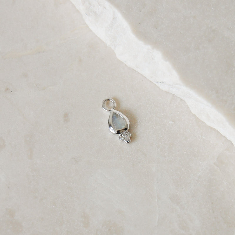 Moonstone & White Sapphire Tear Drop Earring Charm Sterling Silver on marble surface