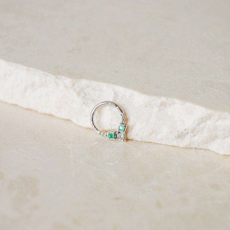 Emerald & Diamond Daith Hoop Earring 9k White Gold on marble surface