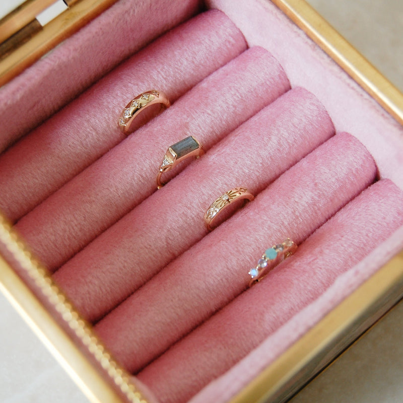 gold huggie hoops in pink jewellery box including the Diamond Starburst Huggie Hoop Earring 9k Gold