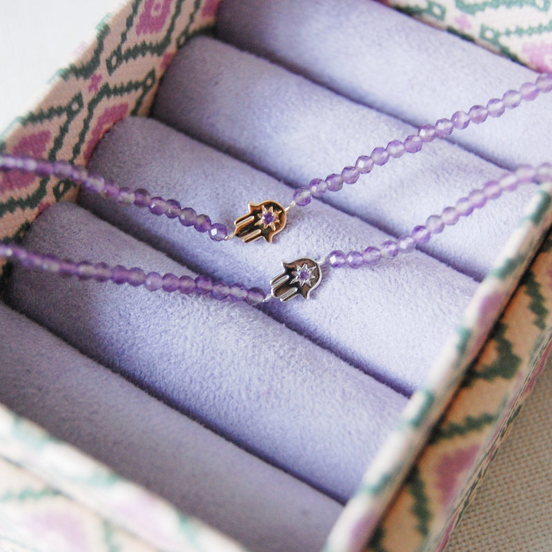 hand of fatima amethyst beaded bracelets in 9k gold and sterling silver in purple jewellery box