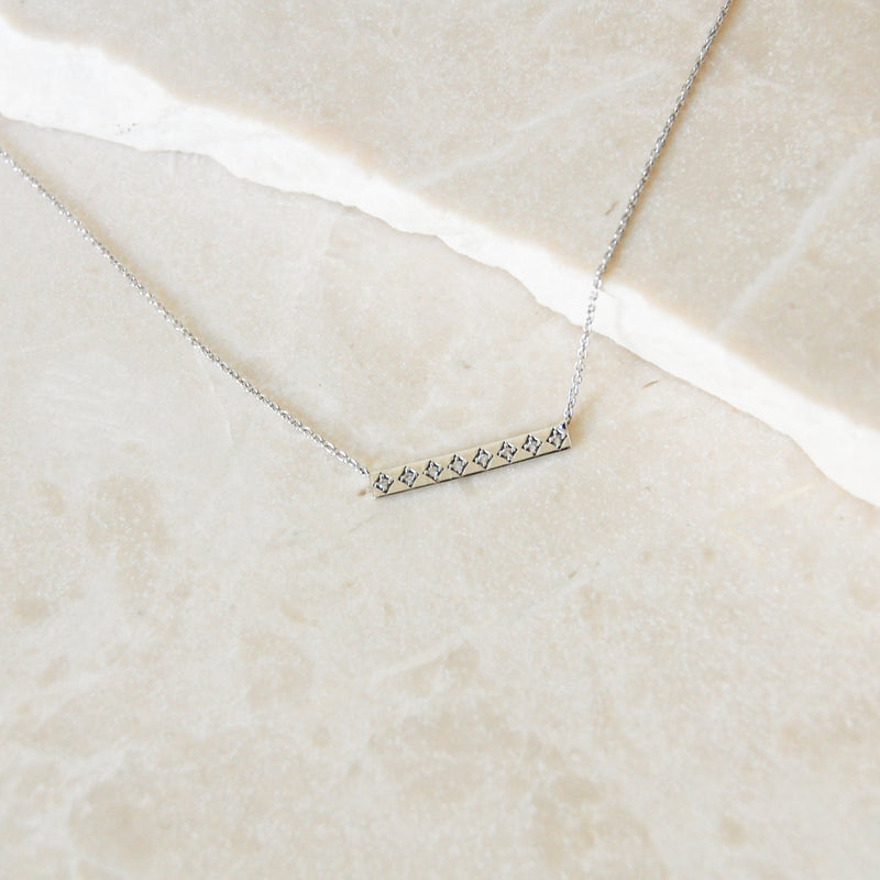 Diamond Bar Necklace 9k White Gold on marble surface