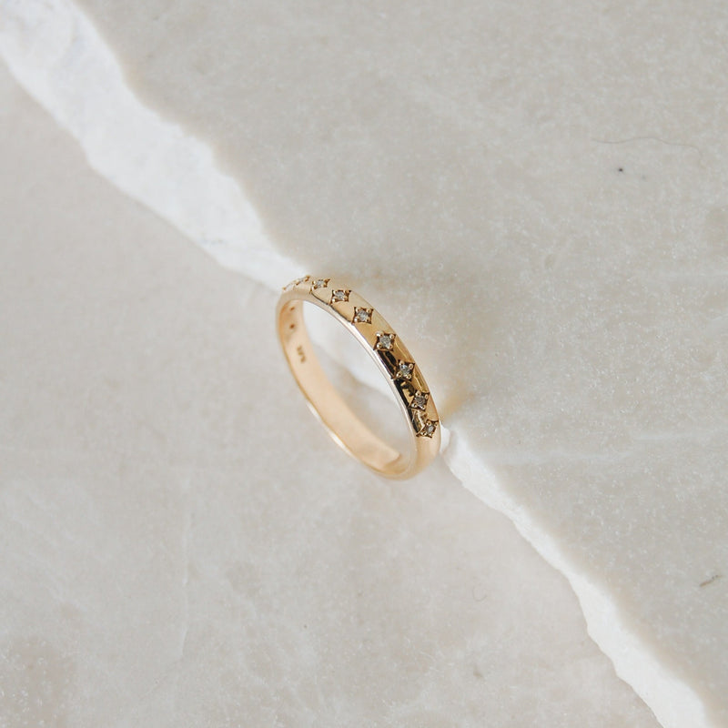 Diamond Star Ring 9k Gold on marble surface
