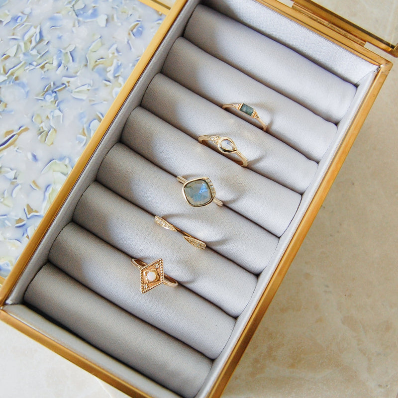 solid gold ring collection in jewellery box  including the Moonstone & Diamond Tear Drop Ring 9k Gold
