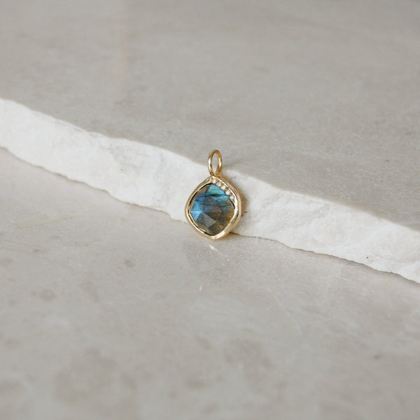 Grecian Labradorite Stone Necklace 9k Gold on marble surface