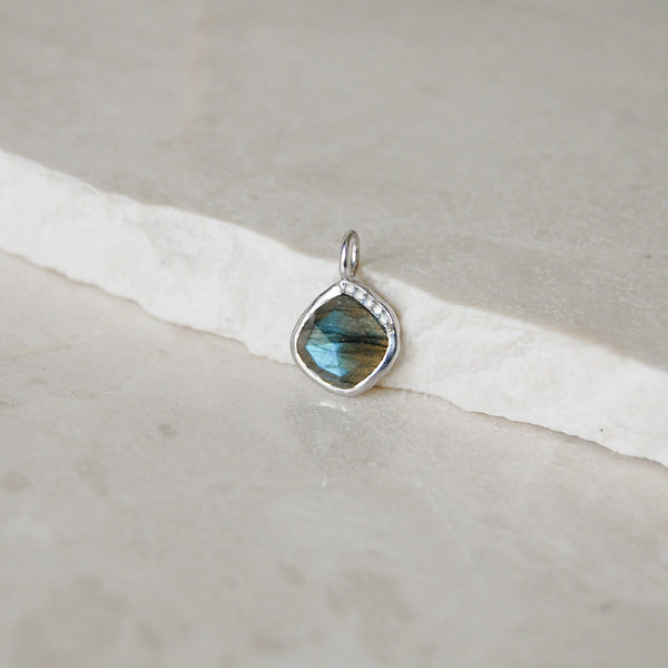 Grecian Labradorite Stone Pendant Sterling Silver on marble surface