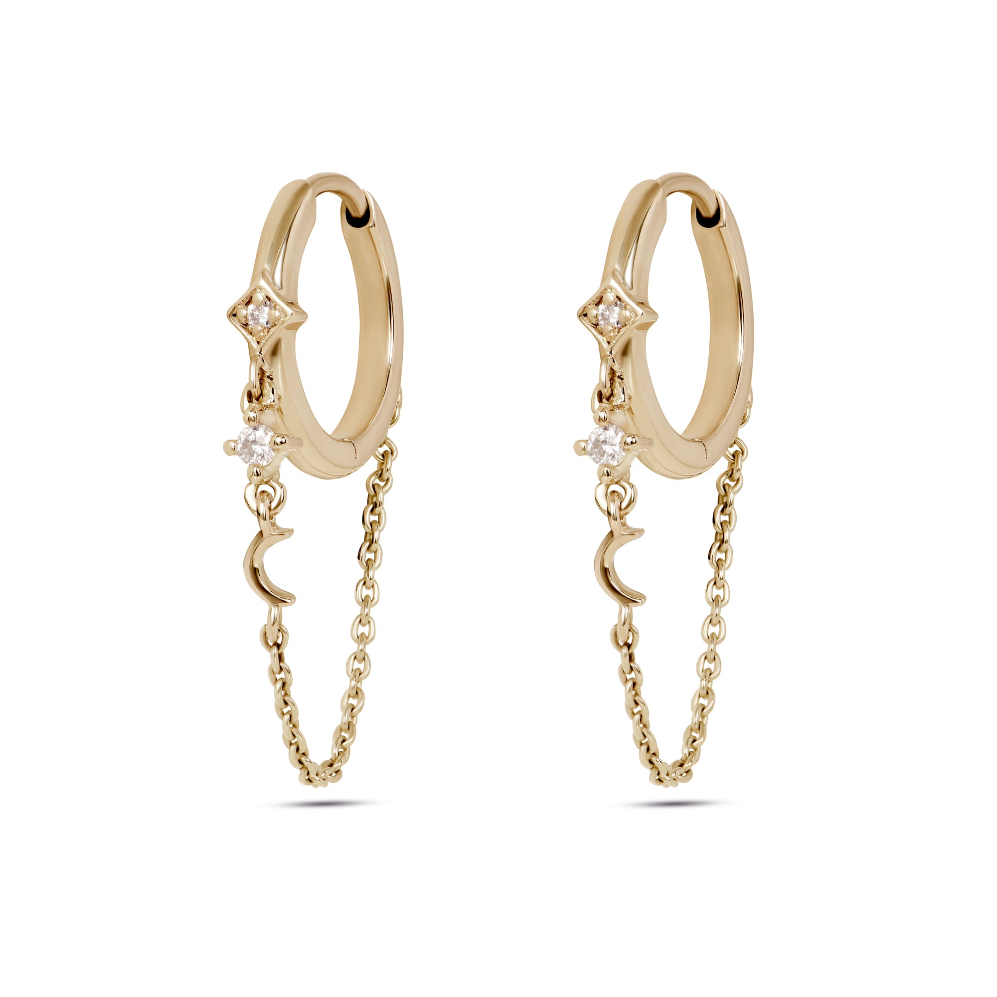 gold huggies with starrs and moon on white background