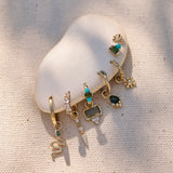 fabric ear dressed with solid gold earrings including the Diamond Drop Spike Earring Charm 9k Gold
