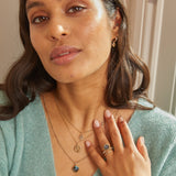 model wearing solid gold jewellery including the diamond open ring 9k gold