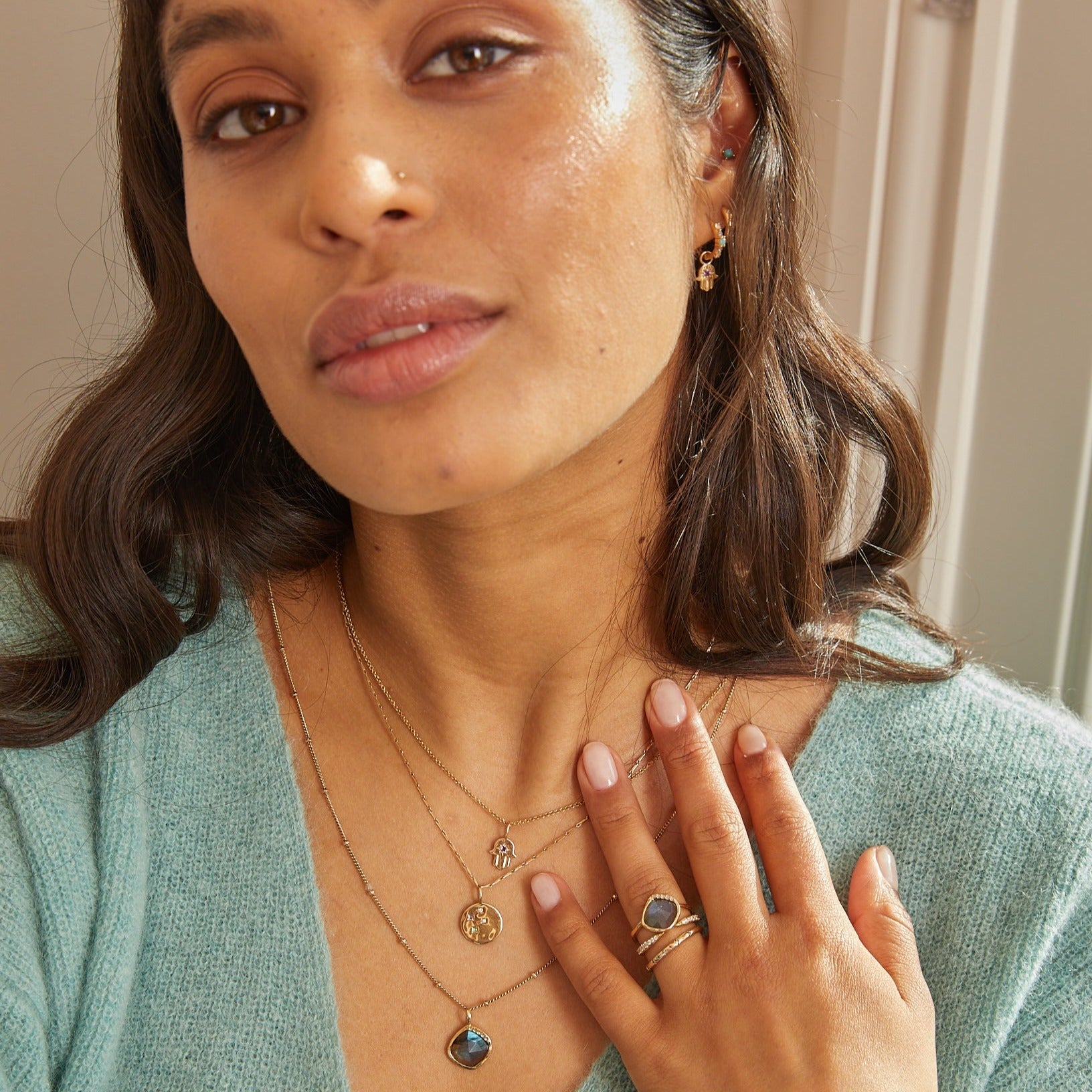 model wearing solid gold jewellery including the diamond open ring 9k gold