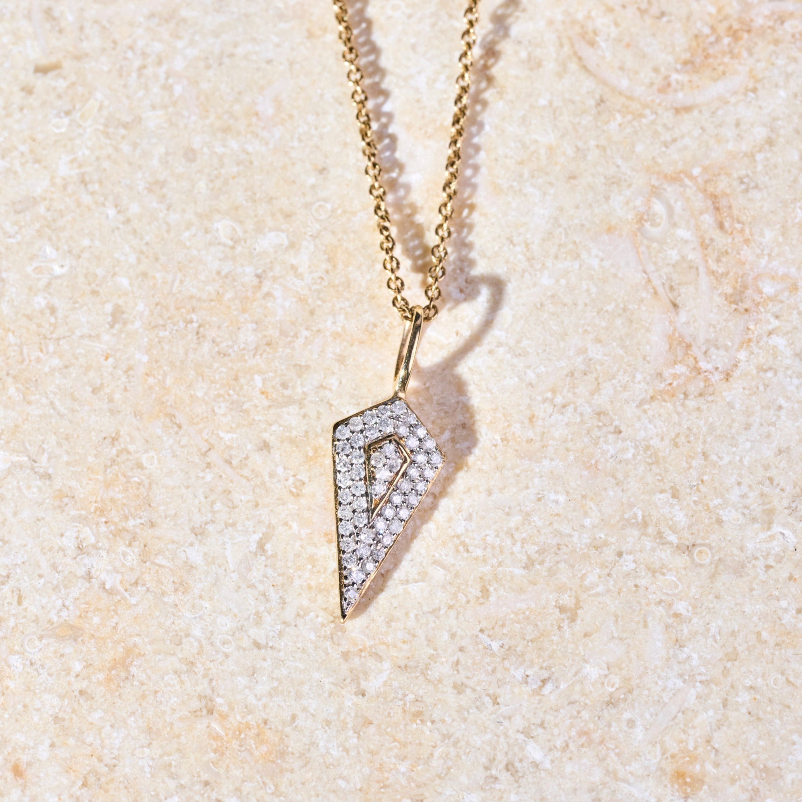 Diamond Rhombus Necklace 9k Gold on hard surface