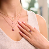 model wearing solid gold jewellery including the Diamond Solitaire Chain Ring 9k Gold