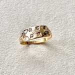 close up of the Diamond Starburst Vintage Ring on hard surface