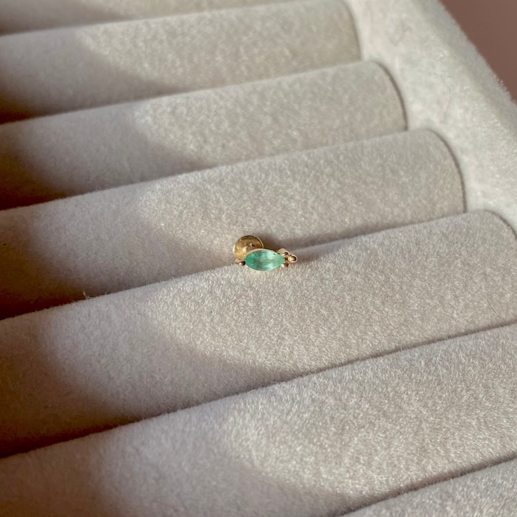 close up of the Emerald Marquise Beaded Flat Back Earring 9k Gold