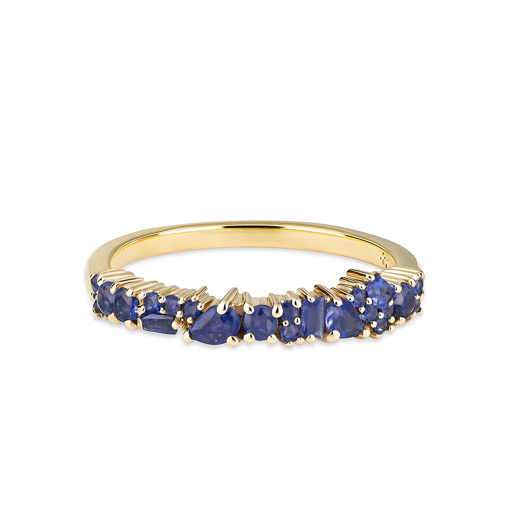 Gold ring with blue gemstones on a white background