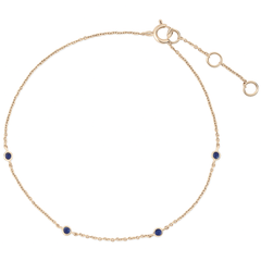 sapphire gold bracelet white background