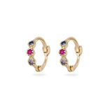 Gold hoop earrings with gemstones on a white background
