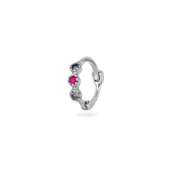 Silver earring with gemstones on a white background