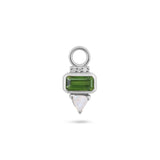 Silver charm with green gemstone and white stone on a white background