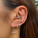 model wearing sterling silver ear stack including the Guava Quartz T-Bar Earring Charm Sterling Silver
