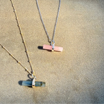 Guava Quartz T-Bar Pendant Sterling Silver displayed on soft fabric along with the labradorite t-bar
