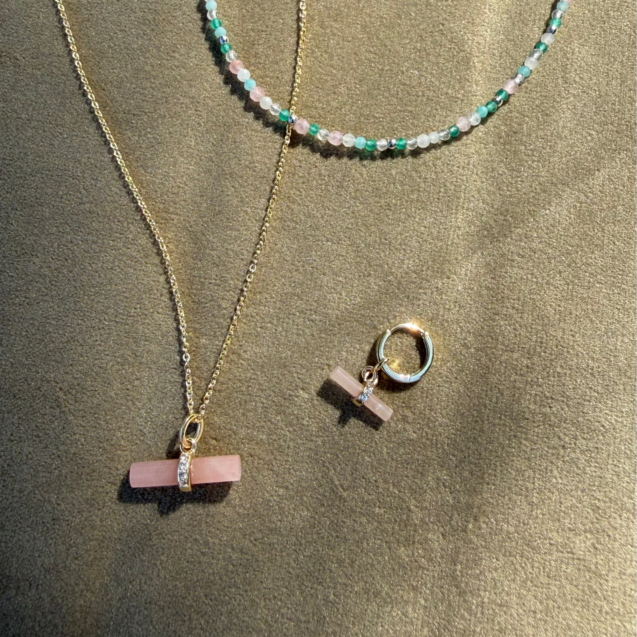 Guava Quartz T-Bar Pendant 9k Gold displayed with matching hoop earring and beaded necklace