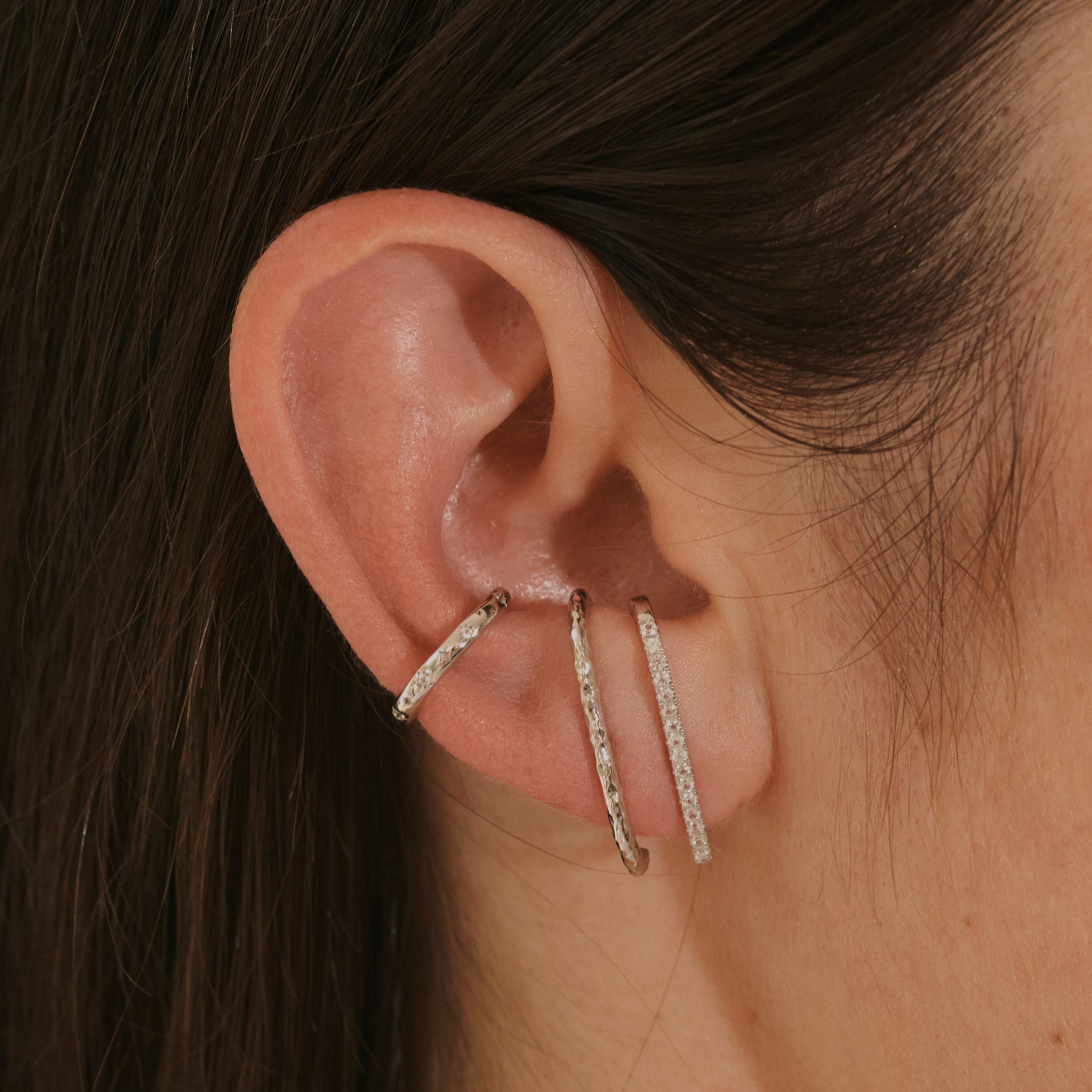 close up of ear stack with suspenders ears including the Hammered Suspender Earring Sterling Silver