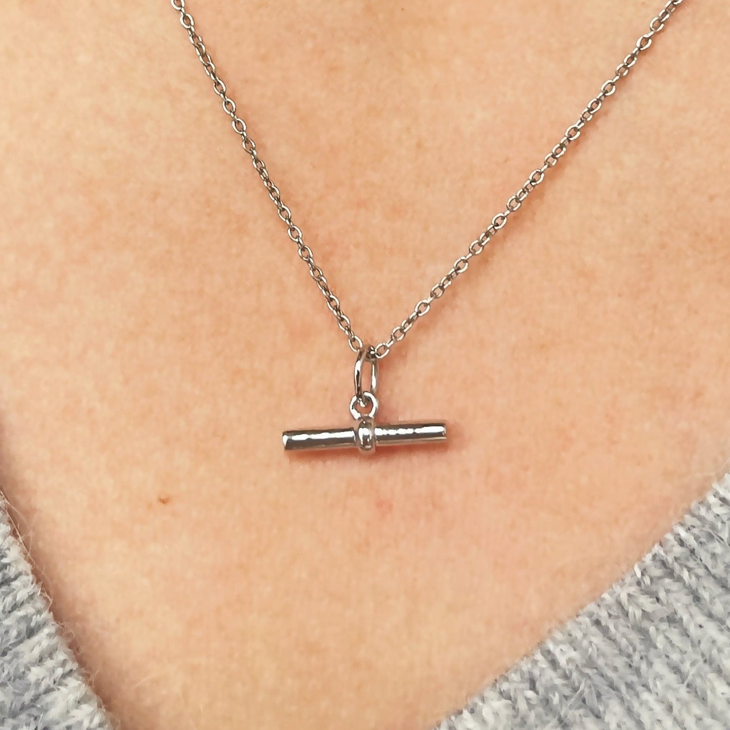 silver t-bar pendant on model 