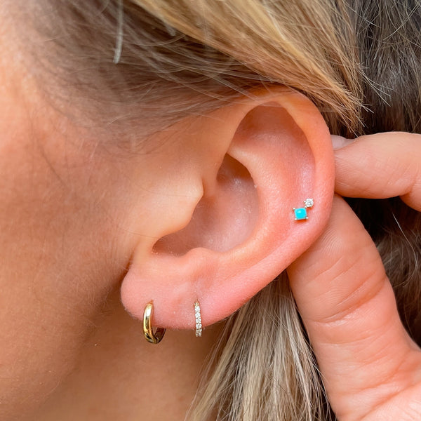 model wearing ear stack and the Turquoise & Diamond Flat Back Earring 9k Gold on helix