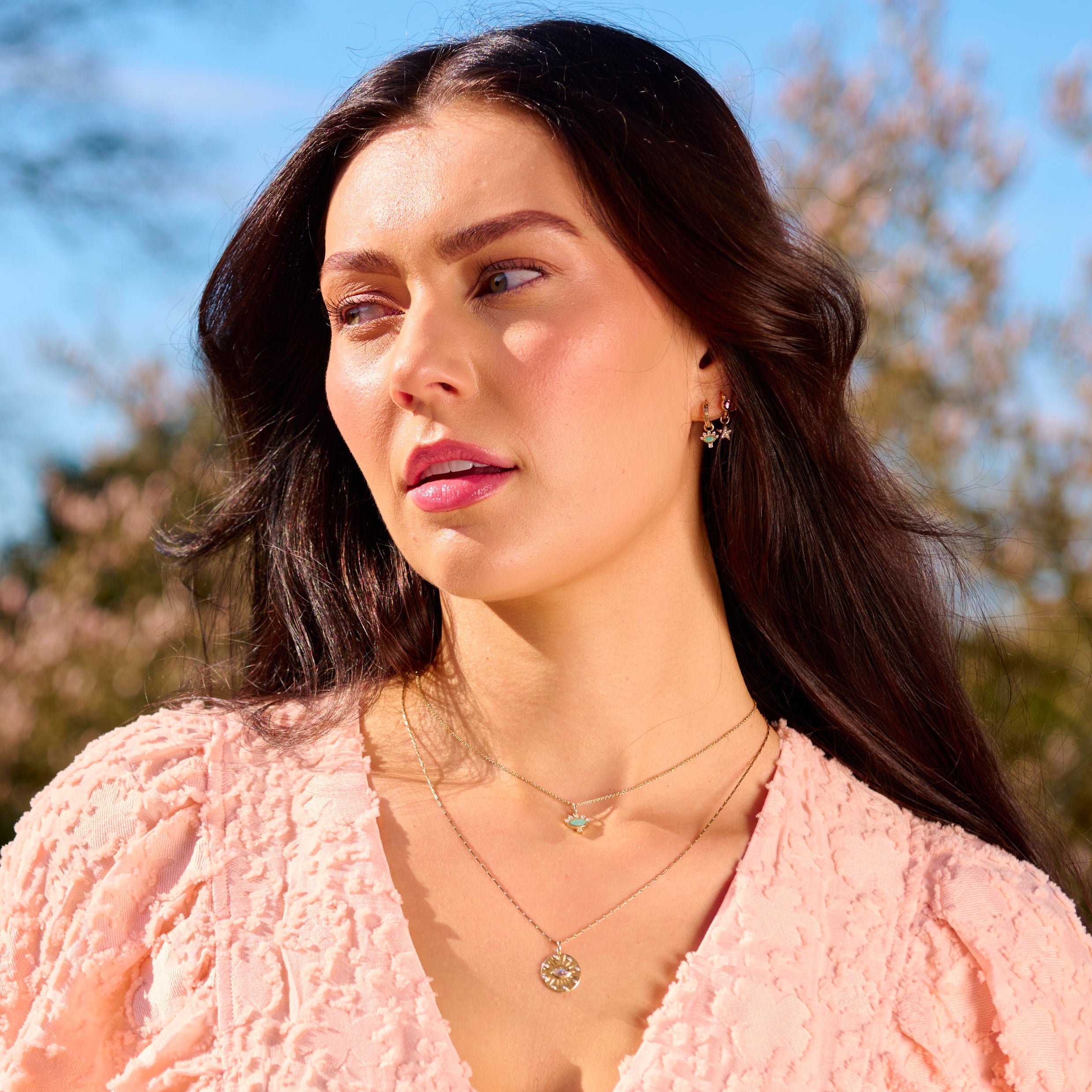 model wearing solid gold pieces including the Labradorite & Diamond Eye Coin Necklace 9k Gold

