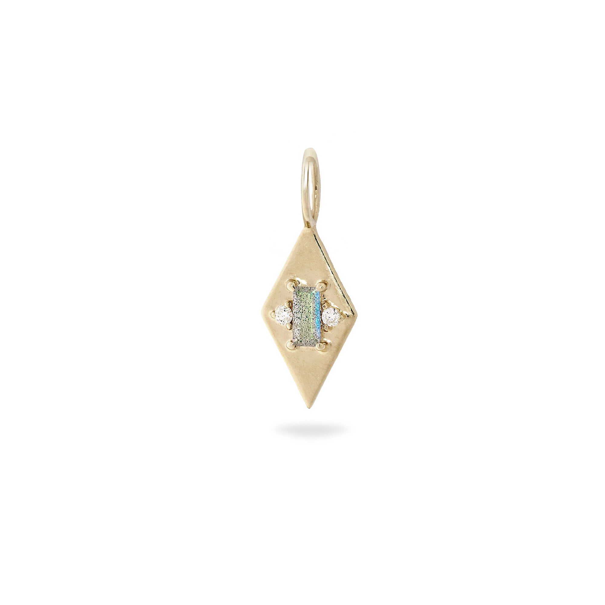 Gold pendant with a green gemstone on a white background