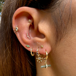 Model wearing solid gold ear stack including the Labradorite T-Bar Earring Charm 9k Gold