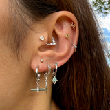 Model wearing sterling silver ear stack including the Labradorite T-Bar Earring Charm Sterling Silver