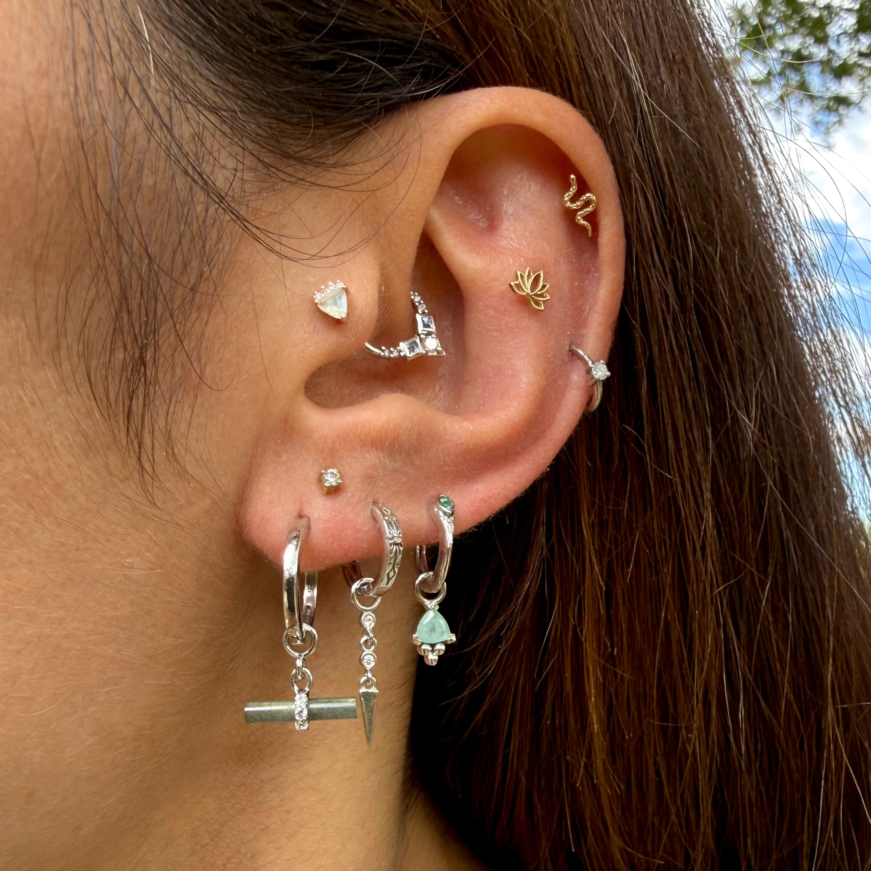 Model wearing sterling silver ear stack including the Labradorite T-Bar Earring Charm Sterling Silver