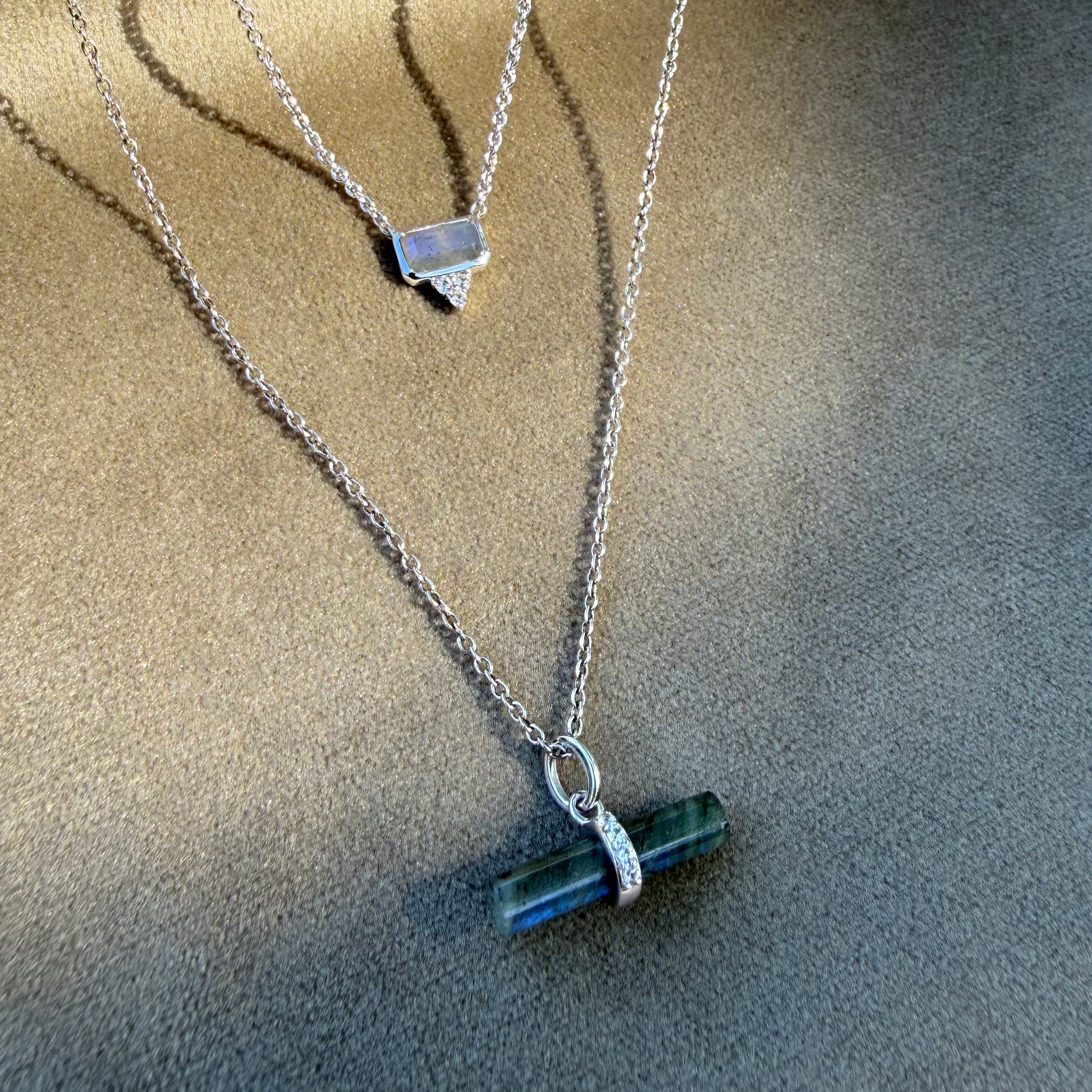 Labradorite T-Bar Pendant Sterling Silver and Labradorite & white sapphire necklace on soft fabric