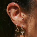 close up of the Labradorite & White Sapphire Earring Charm 9k Gold and other solid gold earrings