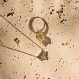 Labradorite & White Sapphire Necklace 9k Gold on hard surface with matching hoop earring