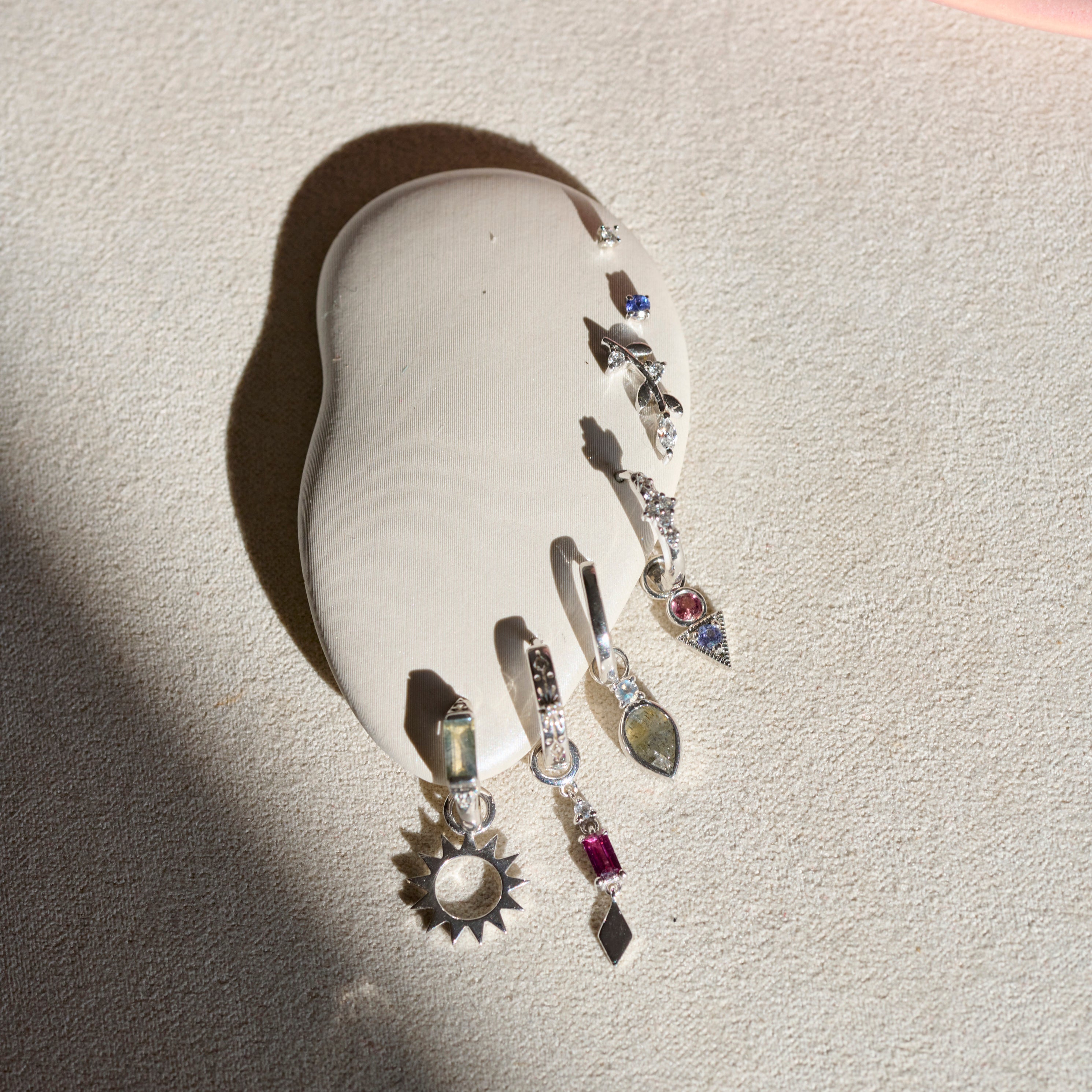 sterling silver earrings on white ear