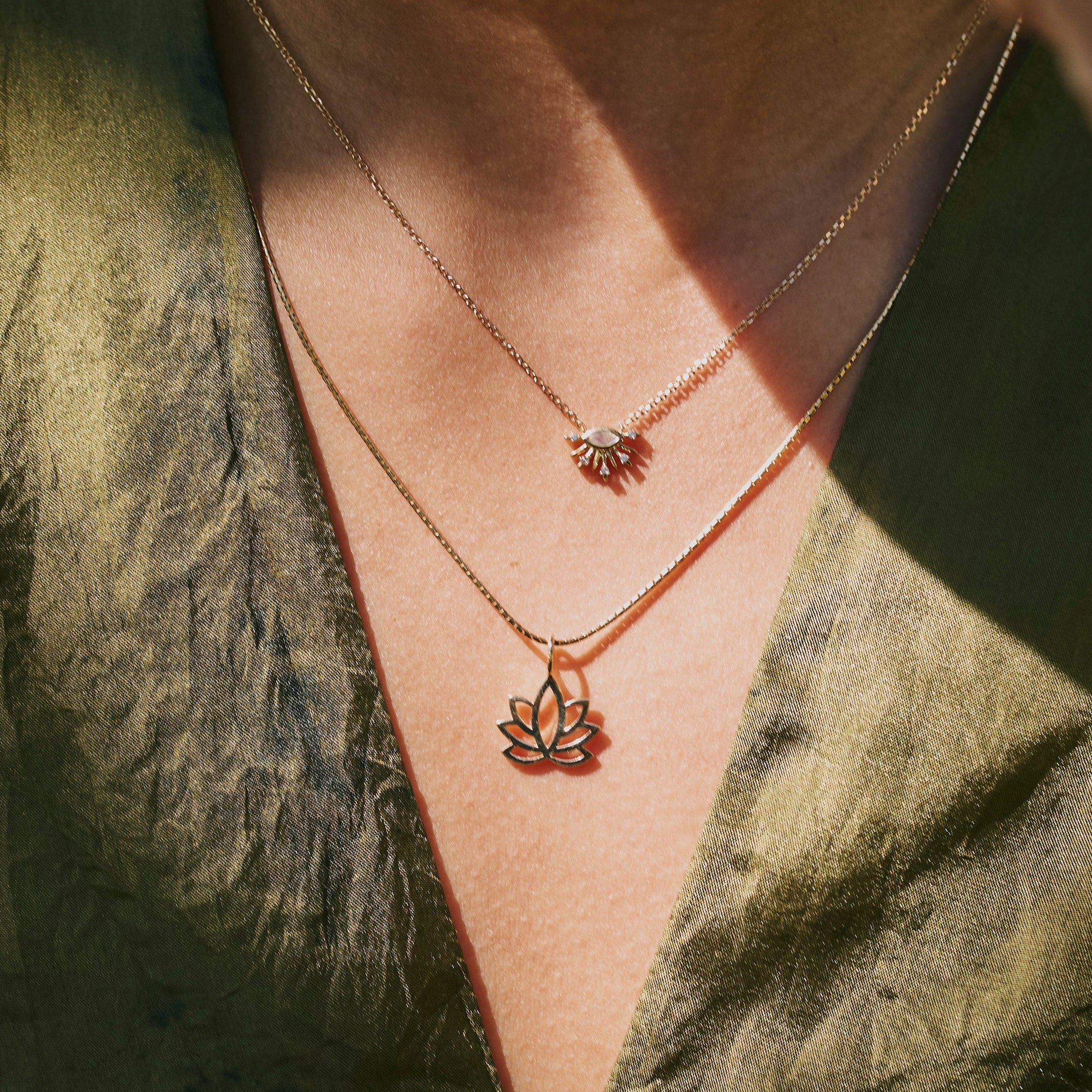 model wearing the Lotus Flower Pendant 9k Gold and the moonstone fan necklace