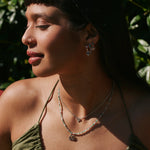 model wearing the Lotus Flower Pendant Sterling Silver with the beaded necklace in silver