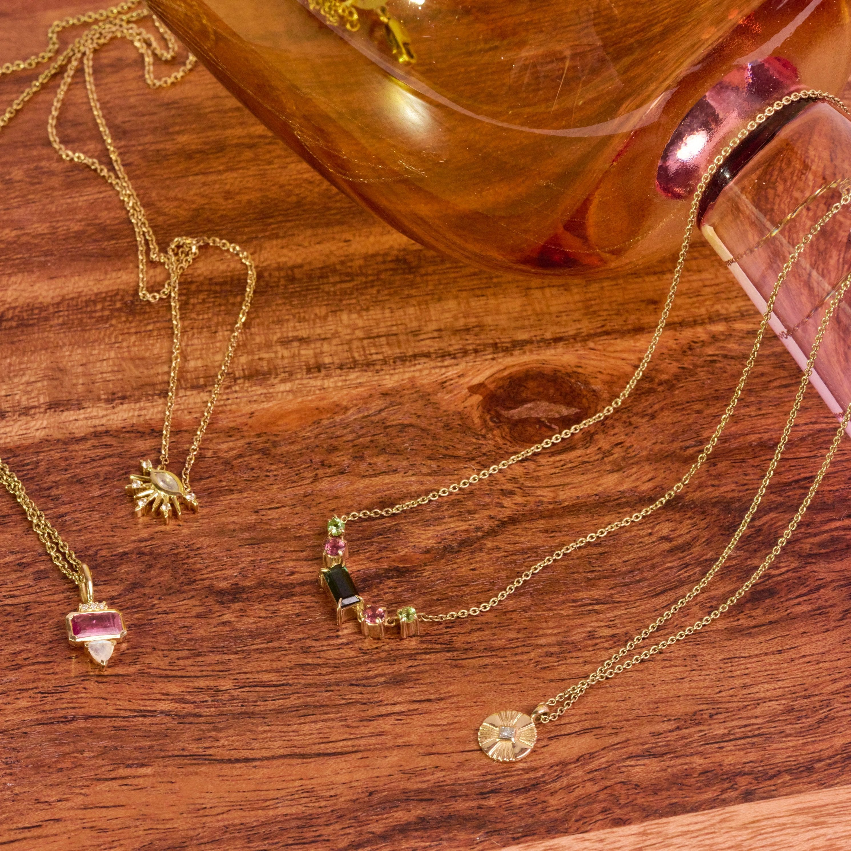 Mini Diamond Coin Pendant 9k Gold displayed along with other solid gold necklaces