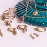 solid gold jewellery displayed including the Mini Diamond Coin Pendant 9k Gold