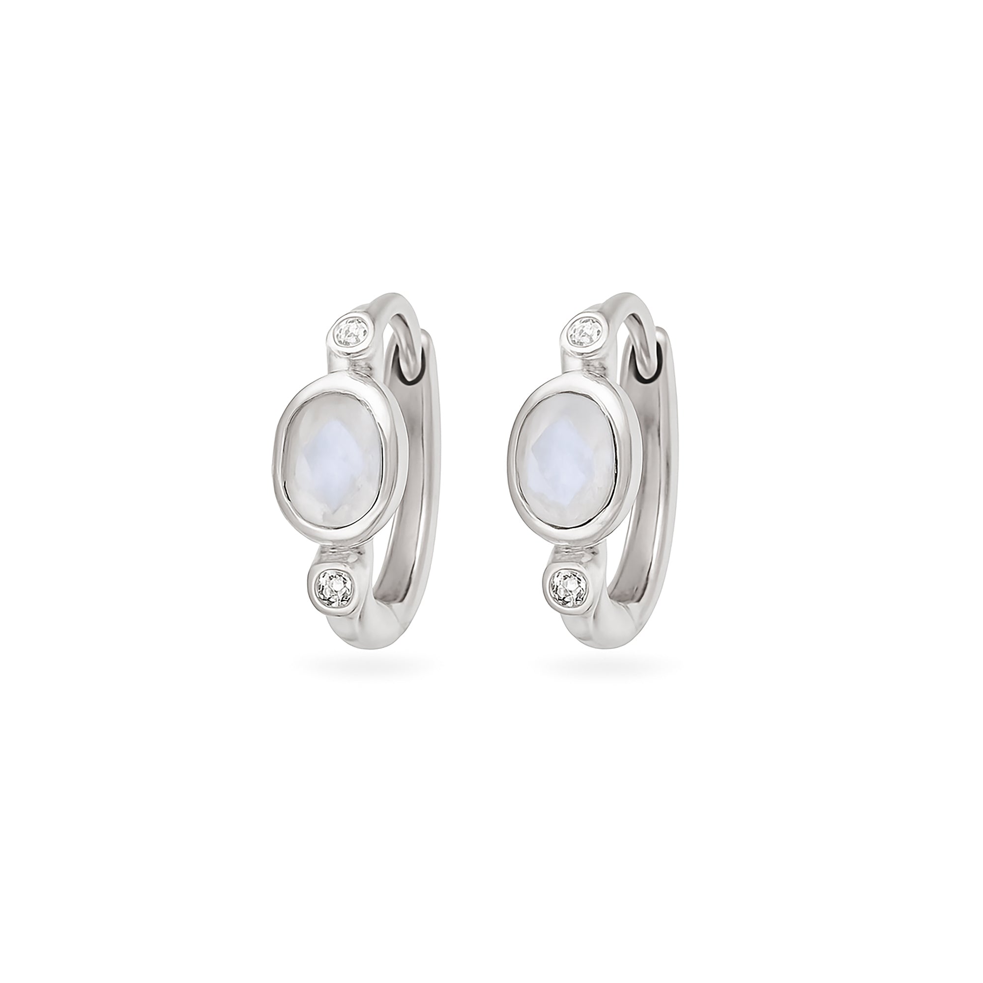 Pair of silver hoop earrings with moonstone stones on a white background