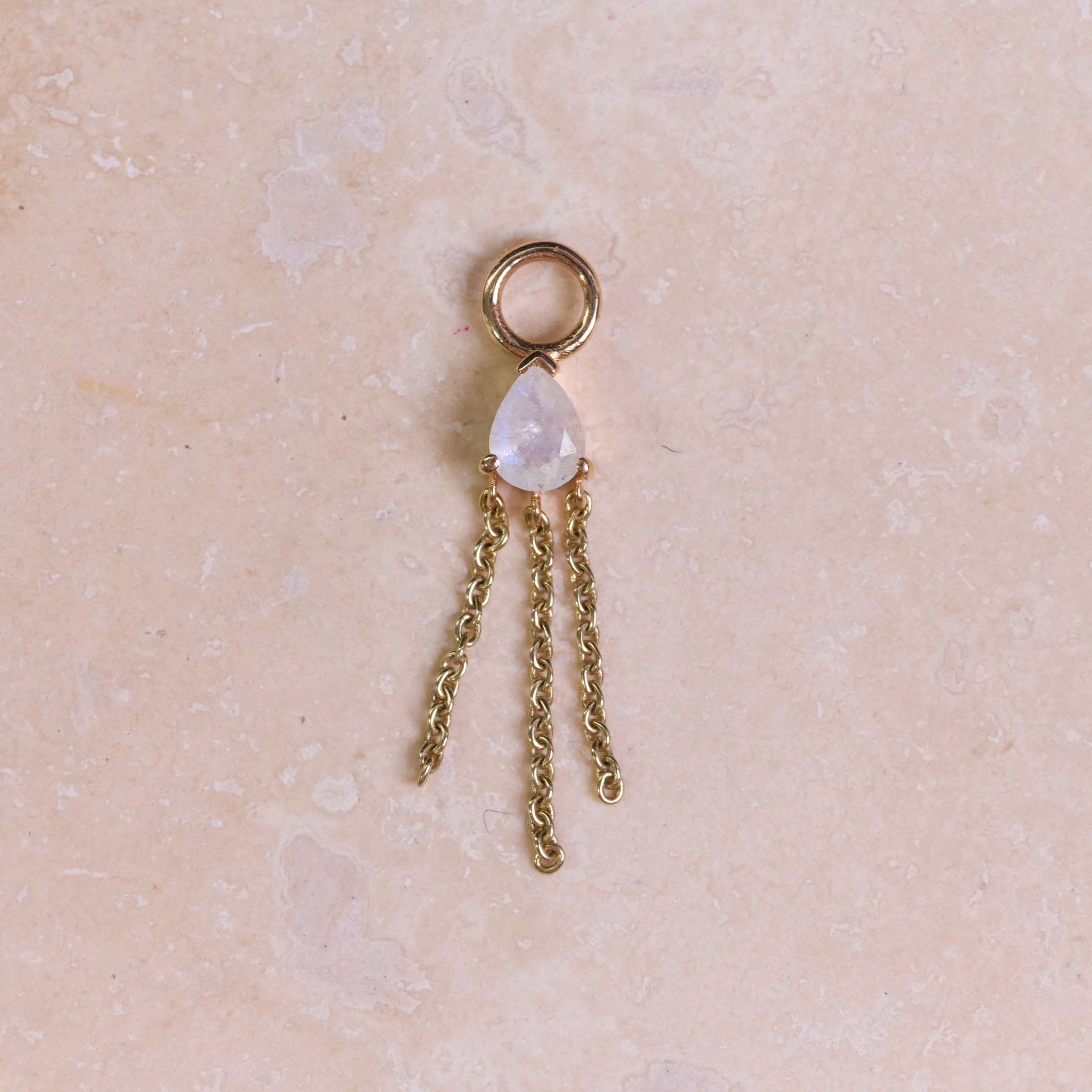 Moonstone Pear Chain Earring Charm 9k Gold on hard surface