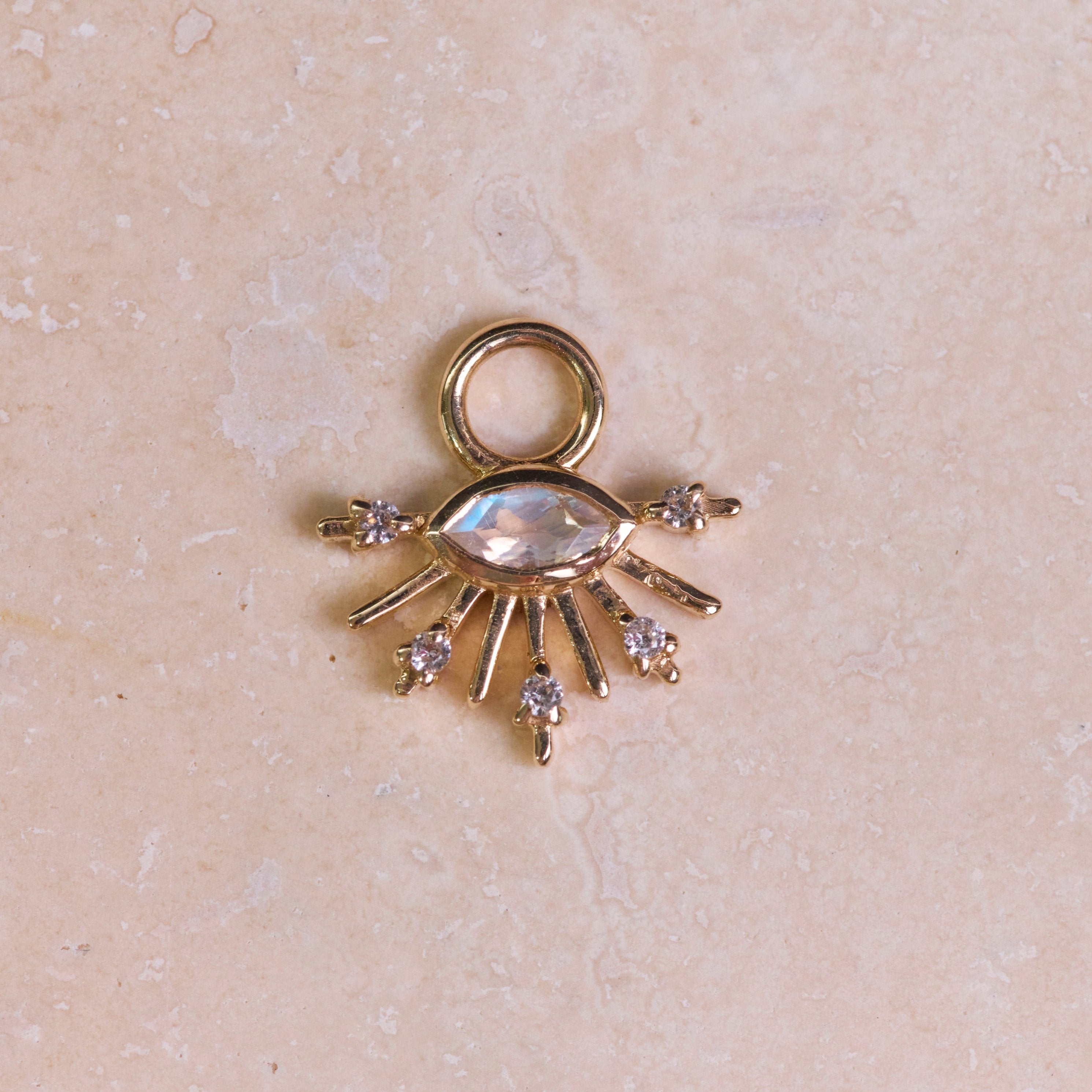 Moonstone & White Sapphire Sunburst Earring Charm 9k Gold on hard surface