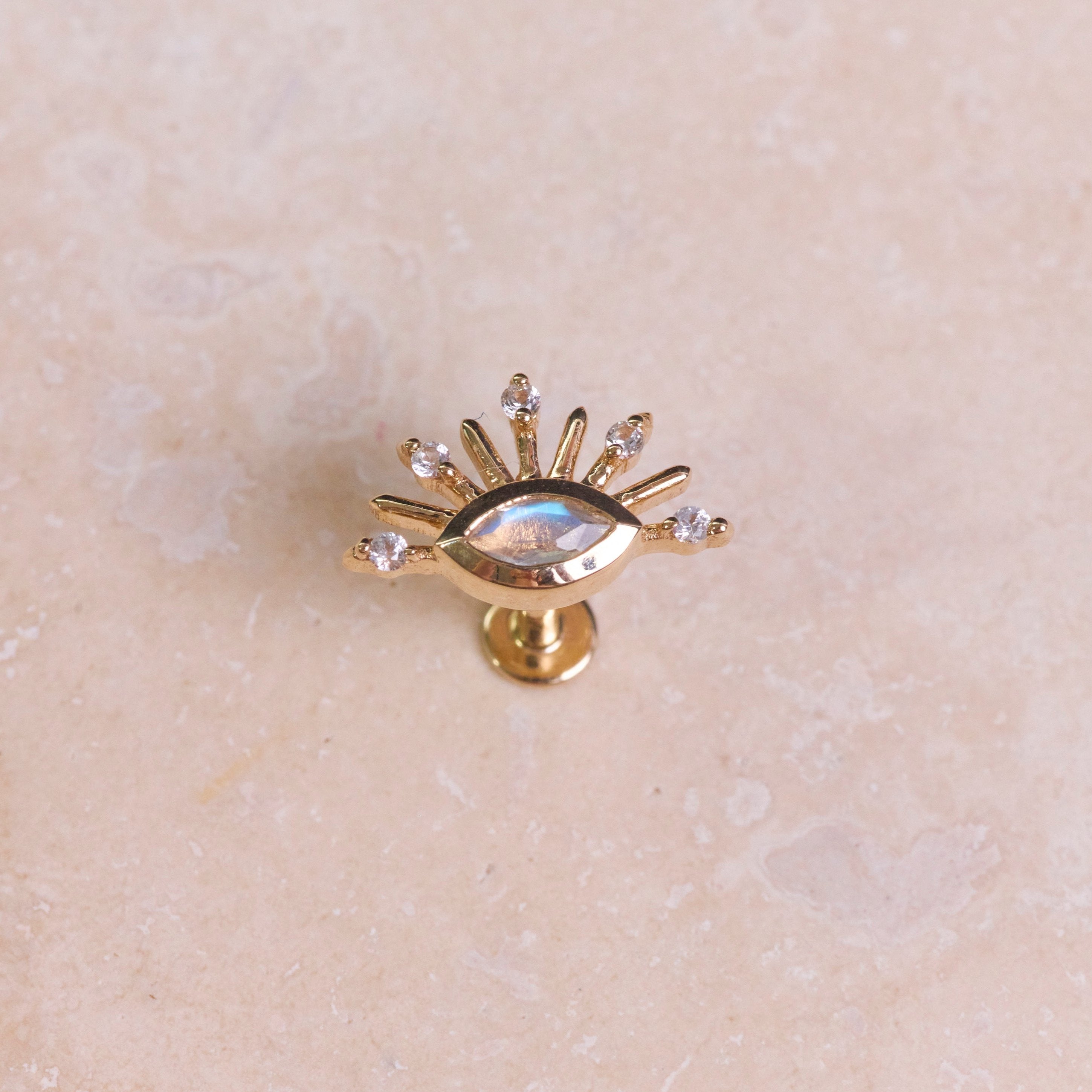 Moonstone & White Sapphire Sunburst Flat Back Earring 9k Gold
on hard surface