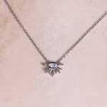 Moonstone & White Sapphire Sunburst Necklace Sterling Silver on hard surface