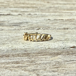 Personalised Gold ring with 'India' on a wooden surface